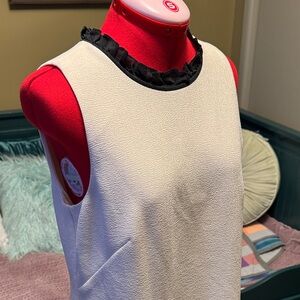 J Crew cream shift dress with silky black ruffle detail at neck and hem